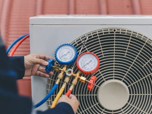 Technician Checking AC Unit